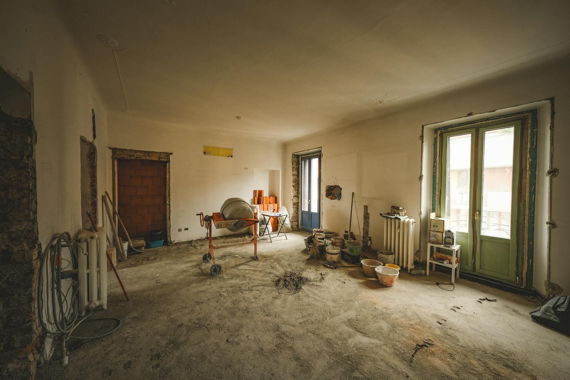 Sunny interior of a home mid-renovation with construction materials and tools
